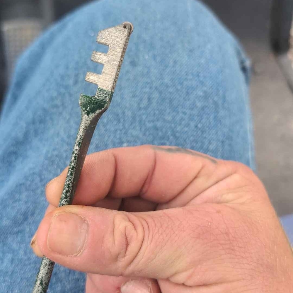 Green and Silver Multi-Tool Key